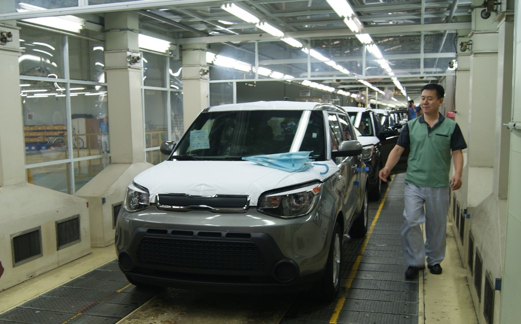 Final products of KIA cars come n row from inside the assembly operation hall of KIA Motors Plant in Gwangju, south of Seoul.